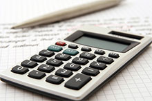 A calculator on a notebook